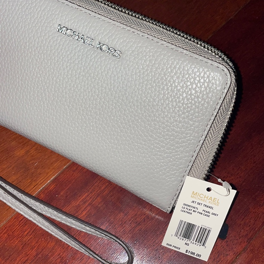 Grey michael kors wristlet wallet and phone holder